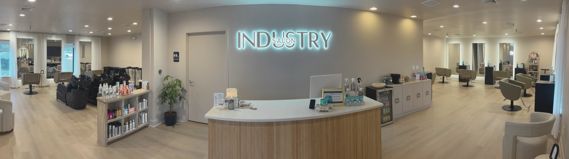 Reception desk and styling floor inside Industry Salon